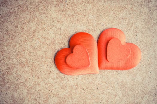 Two Red hearts on the wooden desk background. Copyspace