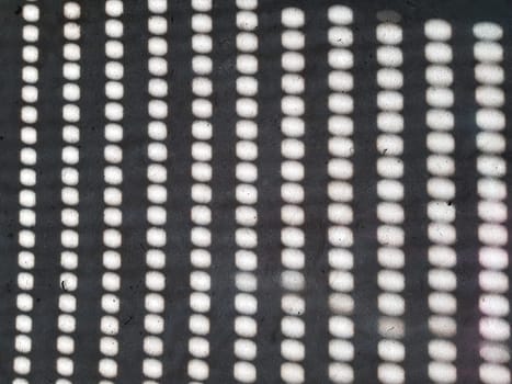 Grid of light. Obtained by penetrating the sun through holes in the shutters.