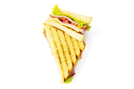 Sandwich with ham, cheese, tomatoes, lettuce, and toasted bread. Above view isolated on white background.