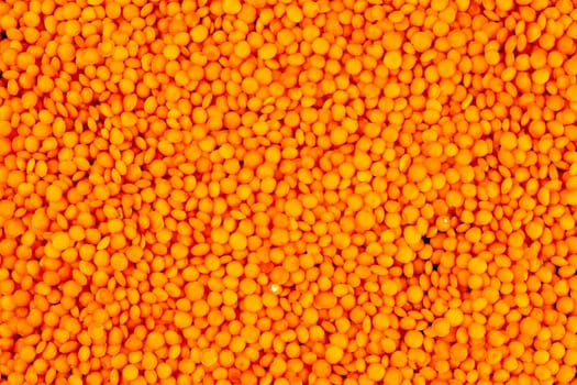Red lentils background macro photography. Top views.