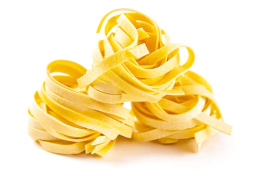 Row dry nest pasta on white bacground. Front views.