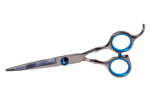 Scissors isolated. Close-up of a new professional scissors for haircuts isolated on a white background. Barbers or hairdresser equipment. Macro photograph.