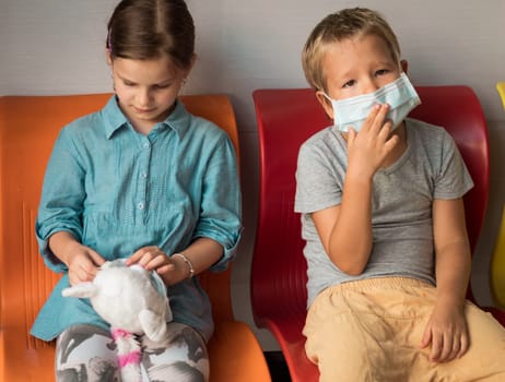 Kids wearing facial disposable mask to avoid viral infection. Virus protection