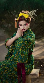 Fine art portrait of beautiful woman in Japanese Geisha style wearing kimono