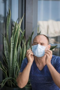 Man wearing facial disposable mask to avoid viral infection. Virus protection
