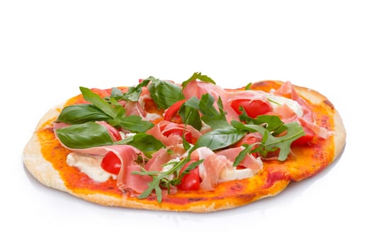 Pizza with mozzarelle cheese tomatoes basil and parma ham white isolated