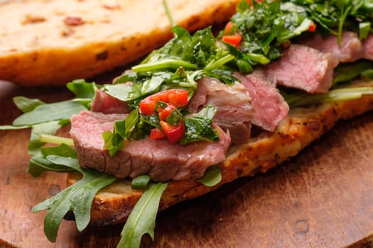 Beef sous vide with chmichulli herbs chili sauce Sandwich