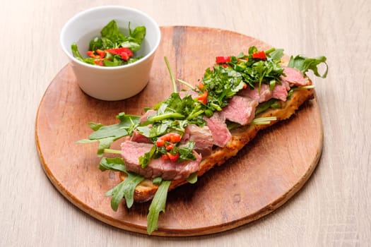 Baguette Sandwich with soud vide beef steak and chimichurri herb sauce