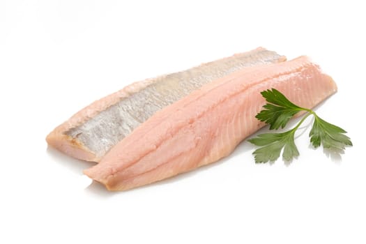 Salted herring with green parsley white isolated