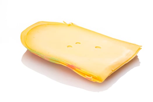 Slices of gouda cheese white isolated