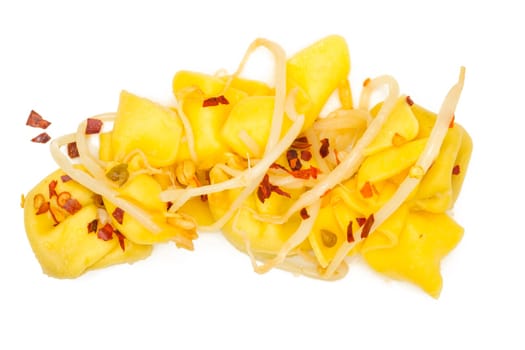 Tortellini with chili and mung beans white isolated