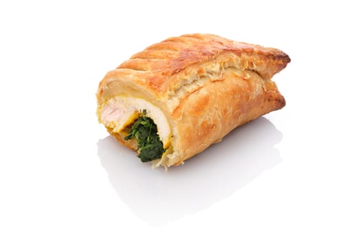 Turkey breast with spinach in puff pastry coat white isolated