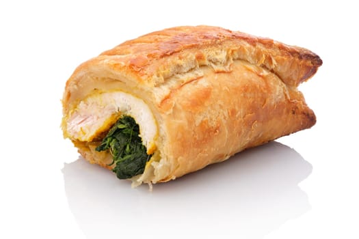 Turkey breast meat with spinach and puff pastry white isolated