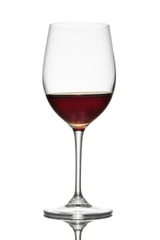 Dessert wine in a glass in back lit white isolated