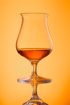 Scotch highland single malt whisky in a glass in back lit