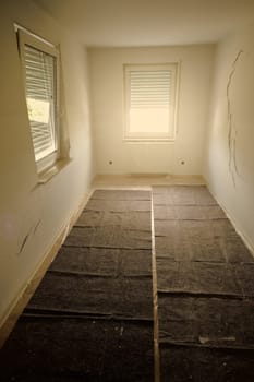 Room renovation with cracks in the wall in vertical format