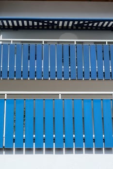 Blue balcony balustrade in vertical format