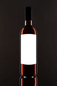 Red wine bottle with blank label and white text space