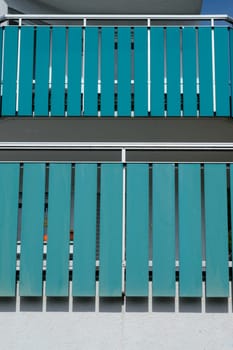 Turquoise balcony with balustrade of aluminium in vertrical format