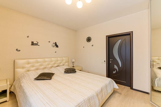 Russia, Moscow- December 05, 2019: interior room apartment modern bright cozy atmosphere. general cleaning, home decoration, preparation of house for sale. bedroom with bed