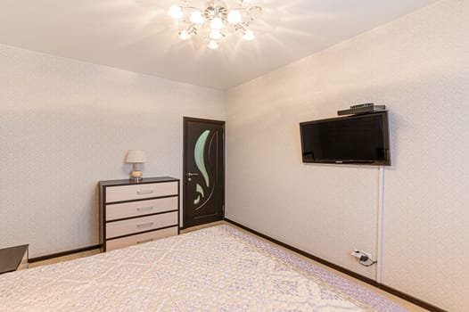 Russia, Moscow- December 05, 2019: interior room apartment modern bright cozy atmosphere. general cleaning, home decoration, preparation of house for sale. bedroom with bed