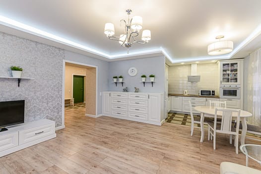 Russia, Moscow- December 05, 2019: interior room apartment modern bright cozy atmosphere. general cleaning, home decoration, preparation of house for sale. modern kitchen, dining area