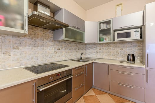 Russia, Moscow- December 05, 2019: interior room apartment modern bright cozy atmosphere. general cleaning, home decoration, preparation of house for sale. modern kitchen, dining area