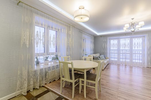 Russia, Moscow- December 05, 2019: interior room apartment modern bright cozy atmosphere. general cleaning, home decoration, preparation of house for sale. modern kitchen, dining area