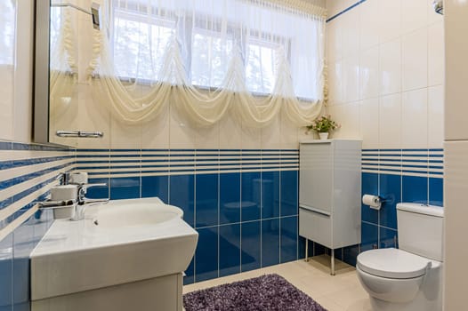 Russia, Moscow- December 05, 2019: interior room apartment modern bright cozy atmosphere. general cleaning, modern bathroom, sink, decoration elements, toilet