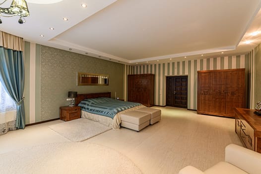 Russia, Moscow- December 05, 2019: interior room apartment modern bright cozy atmosphere. general cleaning, home decoration, preparation of house for sale. bedroom with bed
