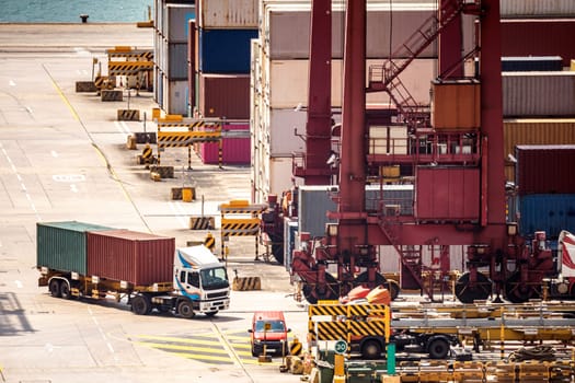 Working at Tsing yi Hong Kong Port for shipping and freight transportation with truck and boat for global business import and export background
