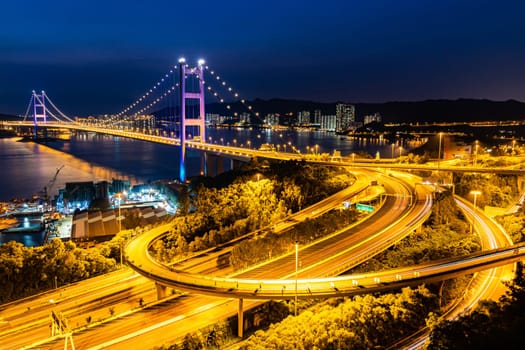 Sunset and light illumination of Tsing ma bridge landmark suspension bridge in Tsing yi area of Hong Kong China.