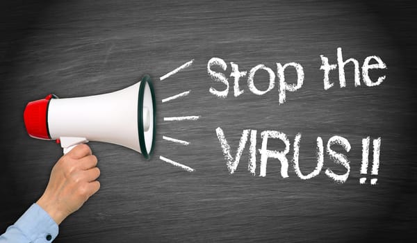 Female hand with loudspeaker, stop the virus