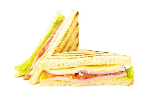 Sandwich with ham, cheese, tomatoes, lettuce, and toasted bread. Front view isolated on white background.