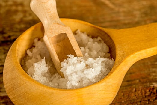 sea salt in a wooden bowl in a closeup