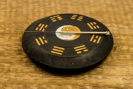 acupuncture needle on Chinese Taoism symbol