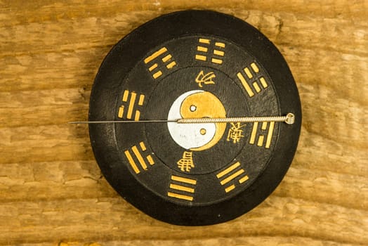 acupuncture needle on Chinese Taoism symbol