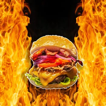 Close-up of home made burgers with fire flames and black background