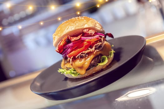 Close-up of home made tasty burgers on plate in restaurant. detail shot
