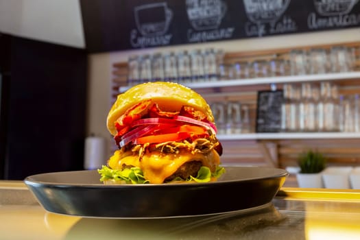 Close-up of home made tasty burgers on plate in restaurant. detail shot