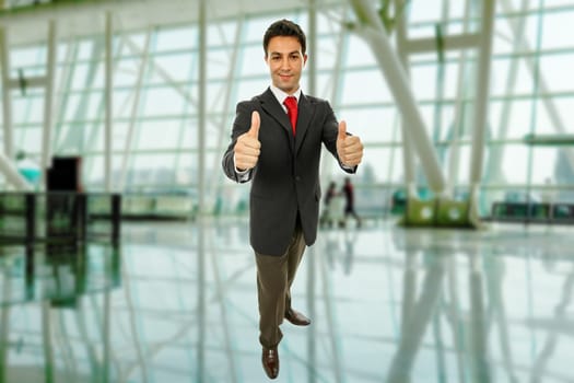 business man going thumbs up at the office