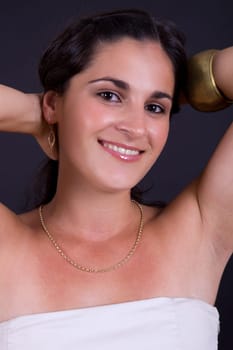 young beautiful brunette portrait against black background