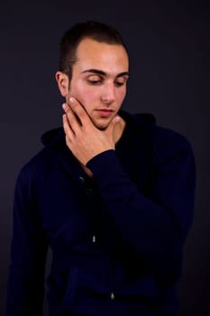 young man portrait, on a black background