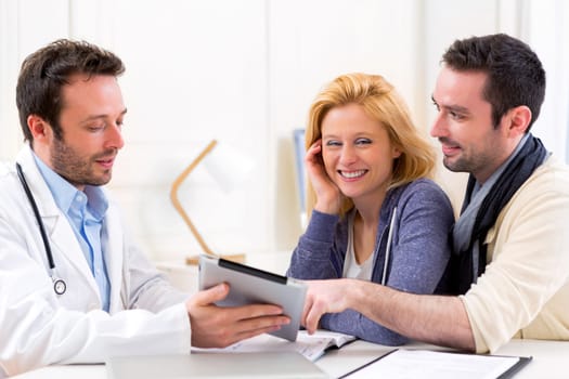 View of a Young attractive couple seeing a doctor