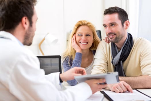 View of a Young attractive couple seeing a doctor