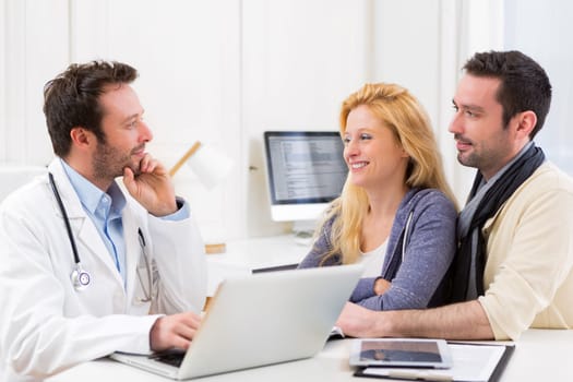 View of a Young attractive couple seeing a doctor
