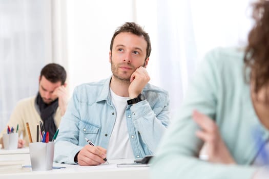 View of a Young attractive man taking exams