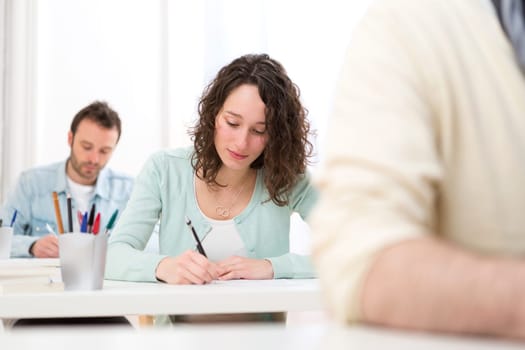 View of a Young attractive student taking exams