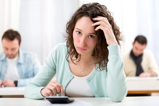 View of Young attractive student during mathematics classes