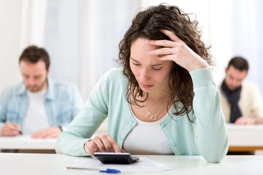 View of Young attractive student during mathematics classes
